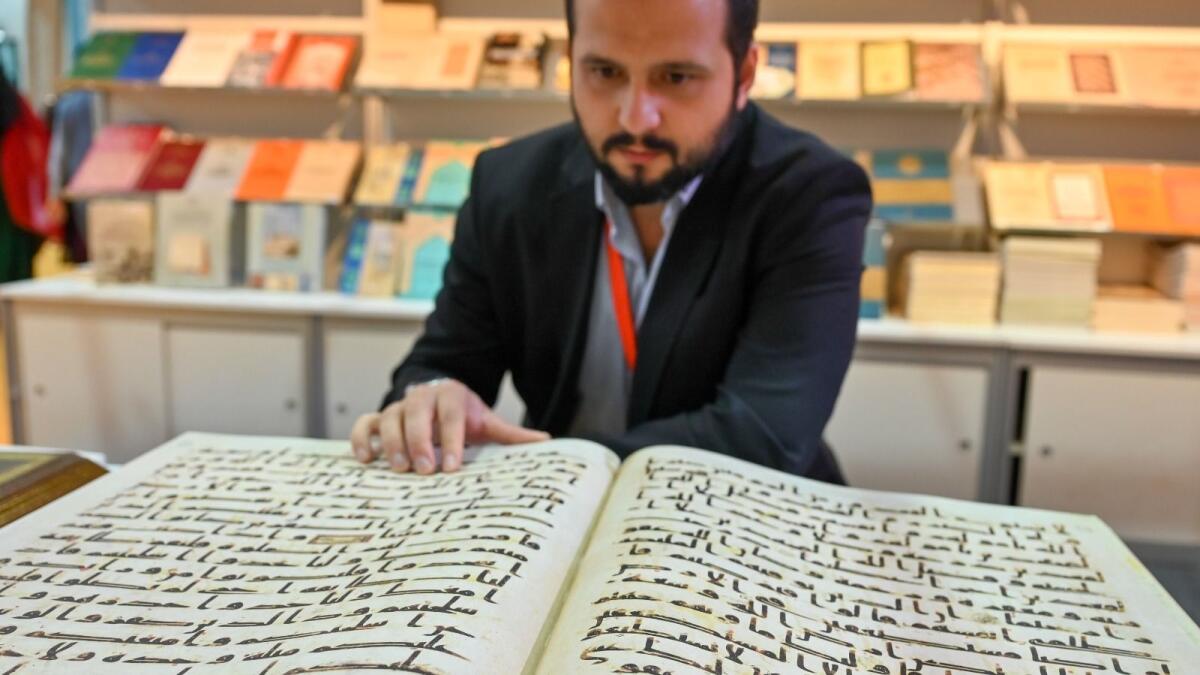 Rephrase the title:Look: Copies of ancient Quran on sale for Dh13,000 at Sharjah book fair – News