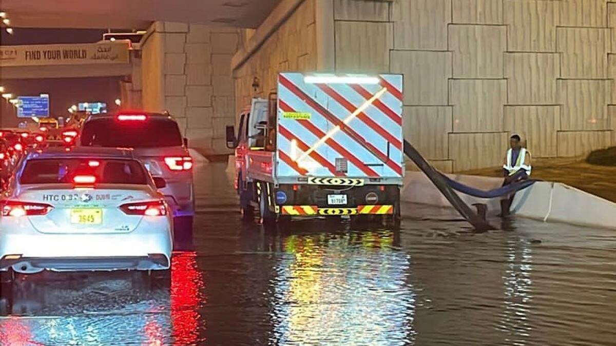 Rephrase the title:Look: Dubai teams work non-stop to clear flooded roads amidst heavy rain – News