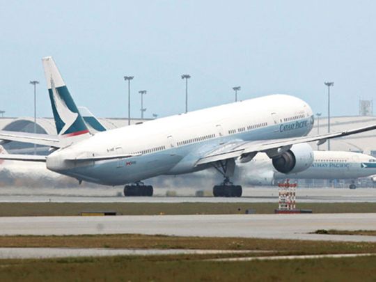 Rephrase the title:Cathay cuts flight time needed for promotion by 25% amid dearth of pilots