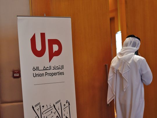 Rephrase the title:Dubai’s Union Properties enters into Dh1.2 billion settlements with Emirates NBD, Dubailand