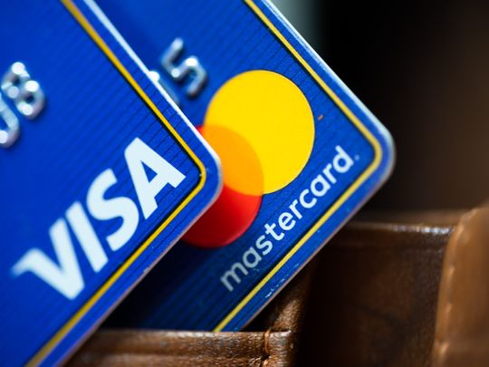 Rephrase the title:Visa, Mastercard reach $30 billion swipe-fee deal with