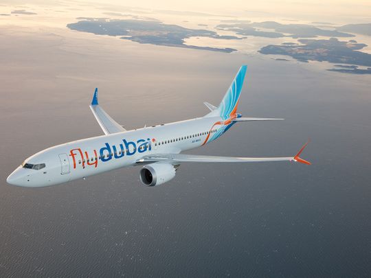 Rephrase the title:Rains in UAE: Dubai carrier flydubai resumes partial operations from DXB